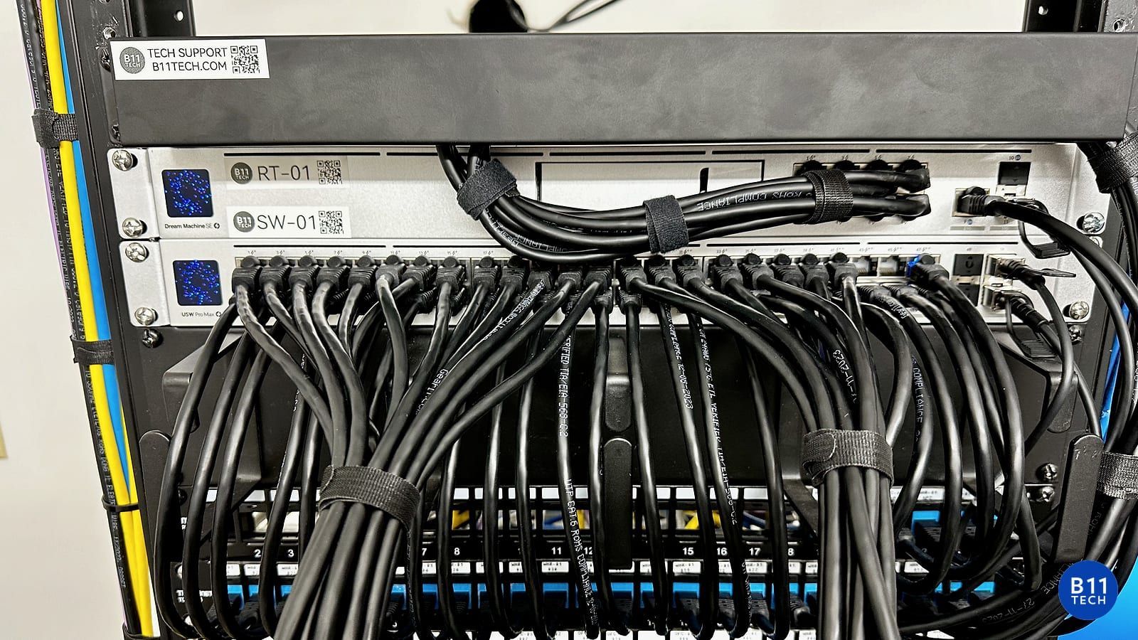 B11 Tech Ethernet installation with labeled UniFi network equipment and organized black patch cables