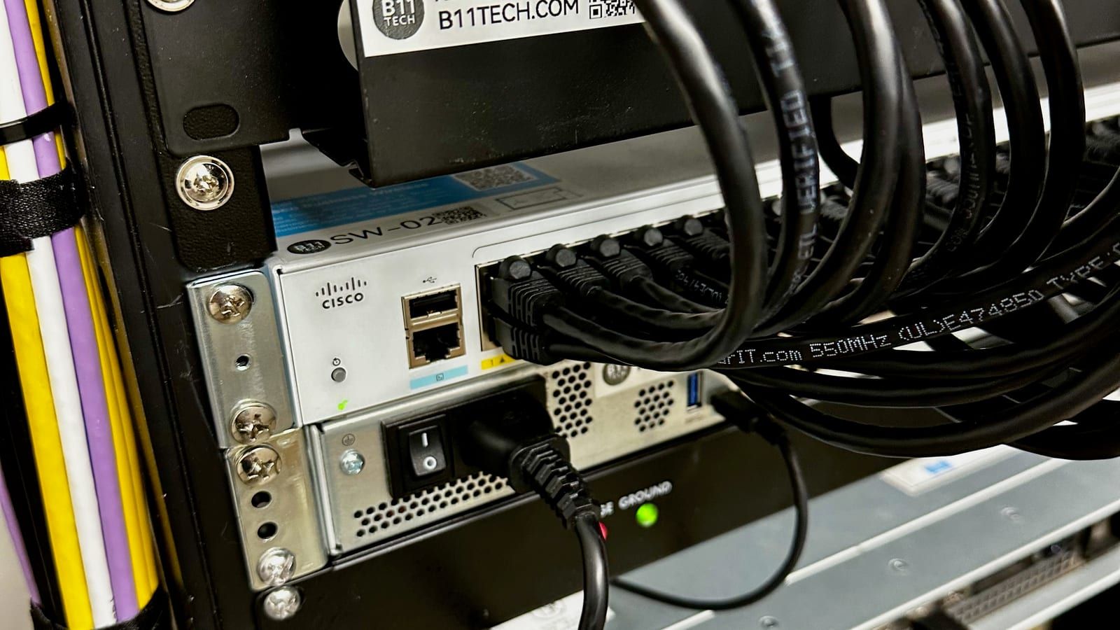 Real B11 Tech structured cabling project with labeled patch panels, switches, and rack equipment in Greater Seattle
