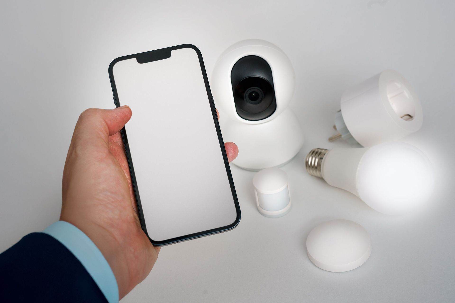 Smartphone connected to a professionally installed Ring security camera system in a Greater Seattle property