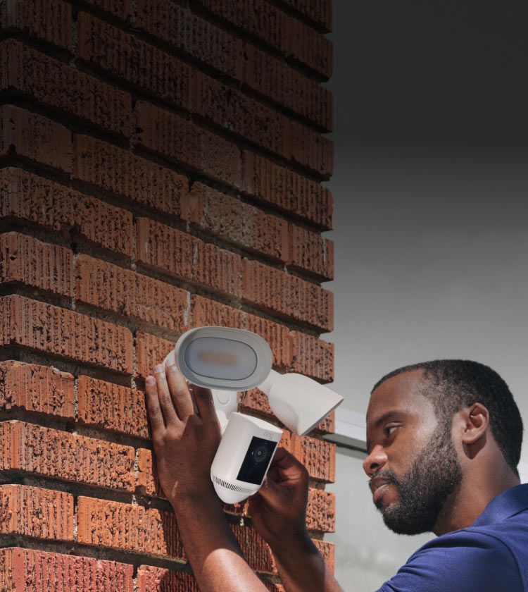 Smartphone connected to a professionally installed Ring security camera system in a Greater Seattle property