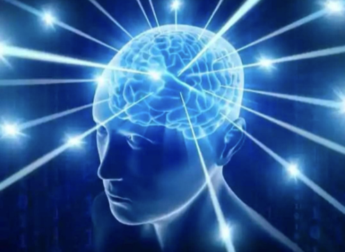 A close up of a person 's head with a brain surrounded by lights.