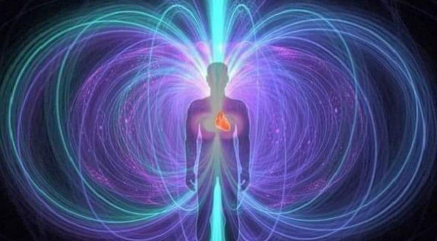 A silhouette of a man with a heart in his chest surrounded by a magnetic field.