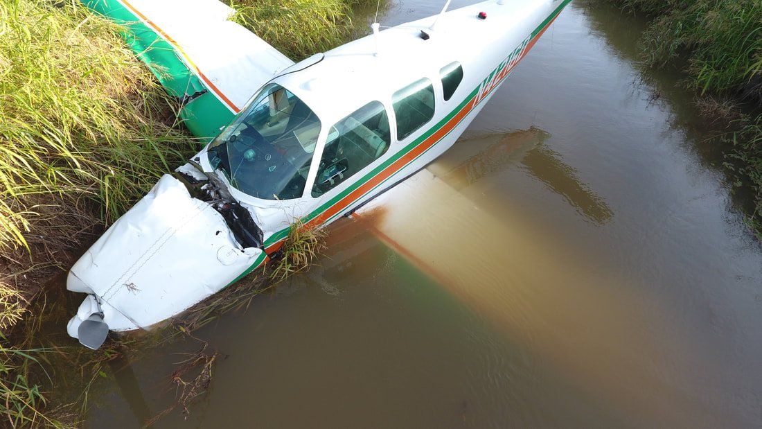 A small plane has crashed into a body of water.