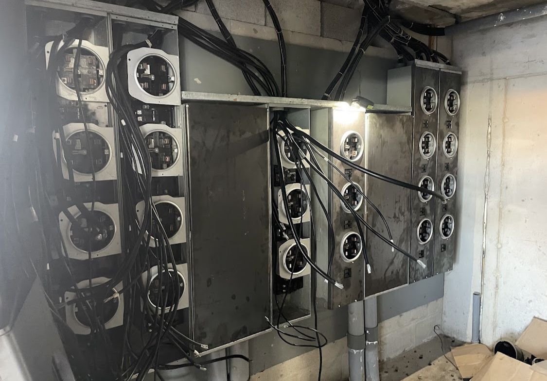A room with a lot of wires hanging from the ceiling.