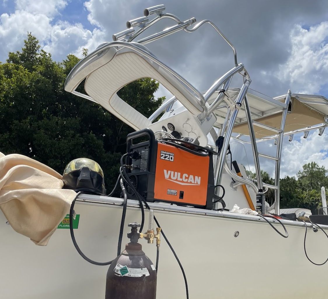 A vulcan welding machine is sitting on top of a boat