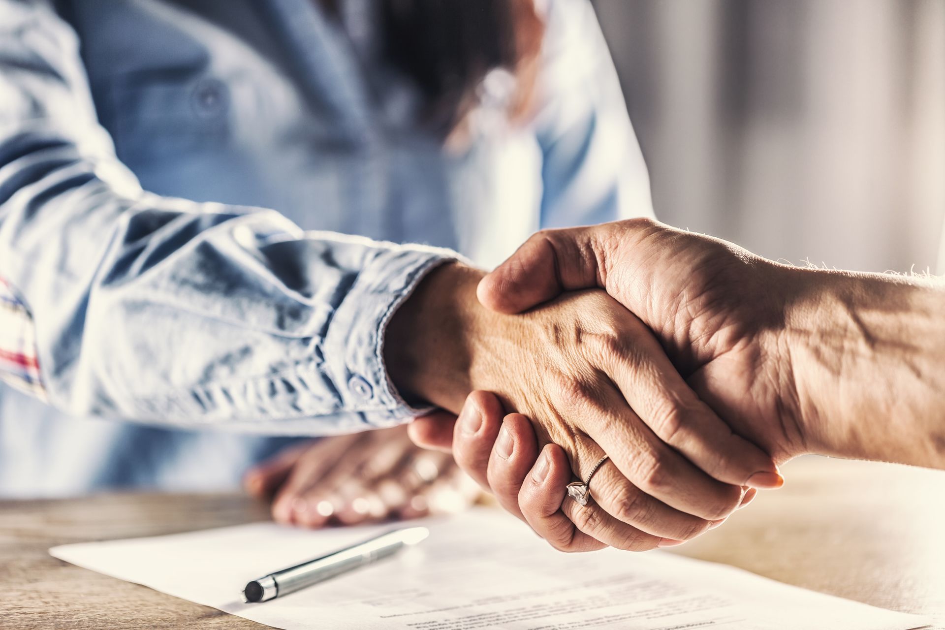 Two persons shaking hands – Springfield, OR – Thorp Purdy Jewett Urness
