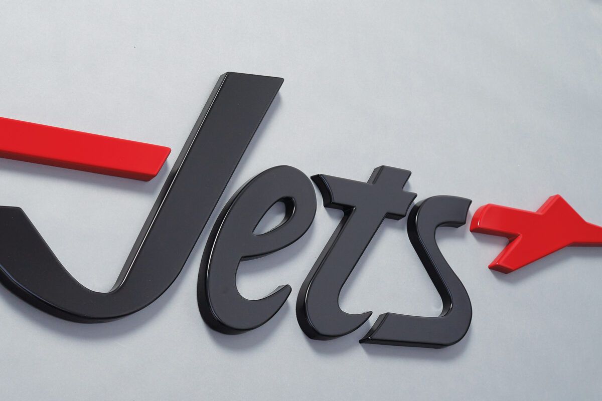 Bold 3D Jets logo sign with red arrow accent