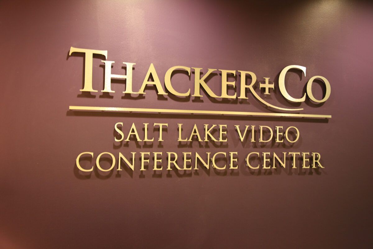 Gold dimensional sign for Thacker and Co Salt Lake Video Conference Center