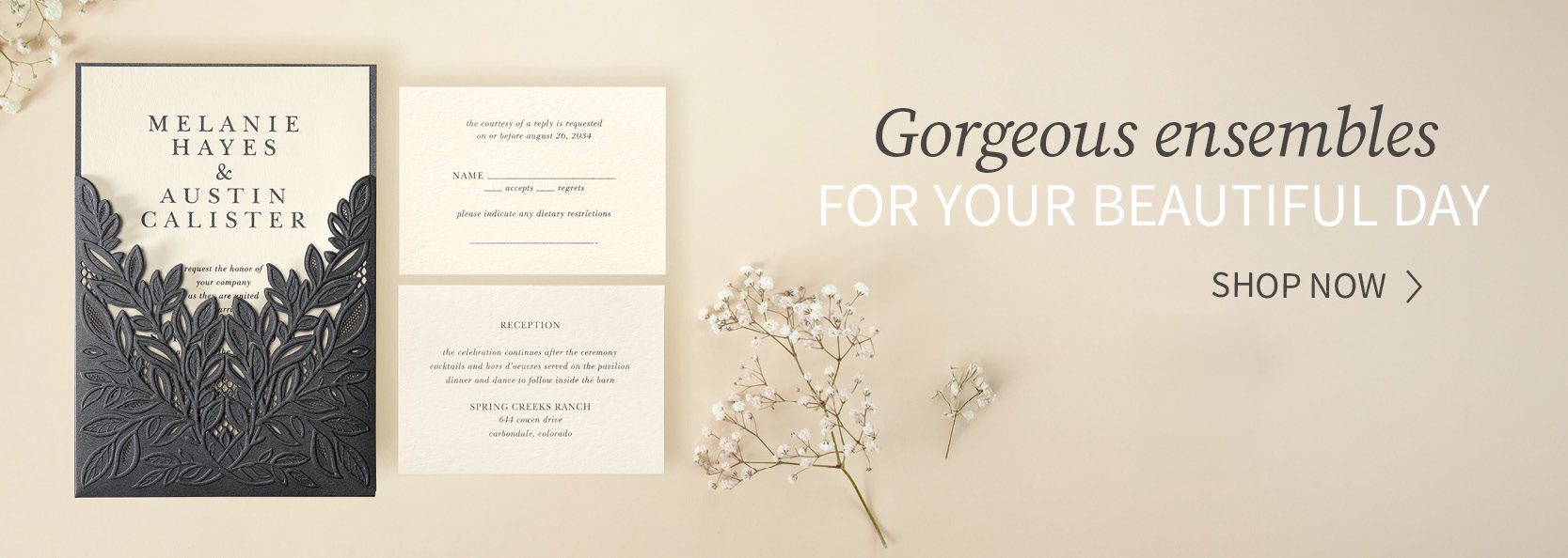Elegant wedding stationery ensemble with invitation and floral accents