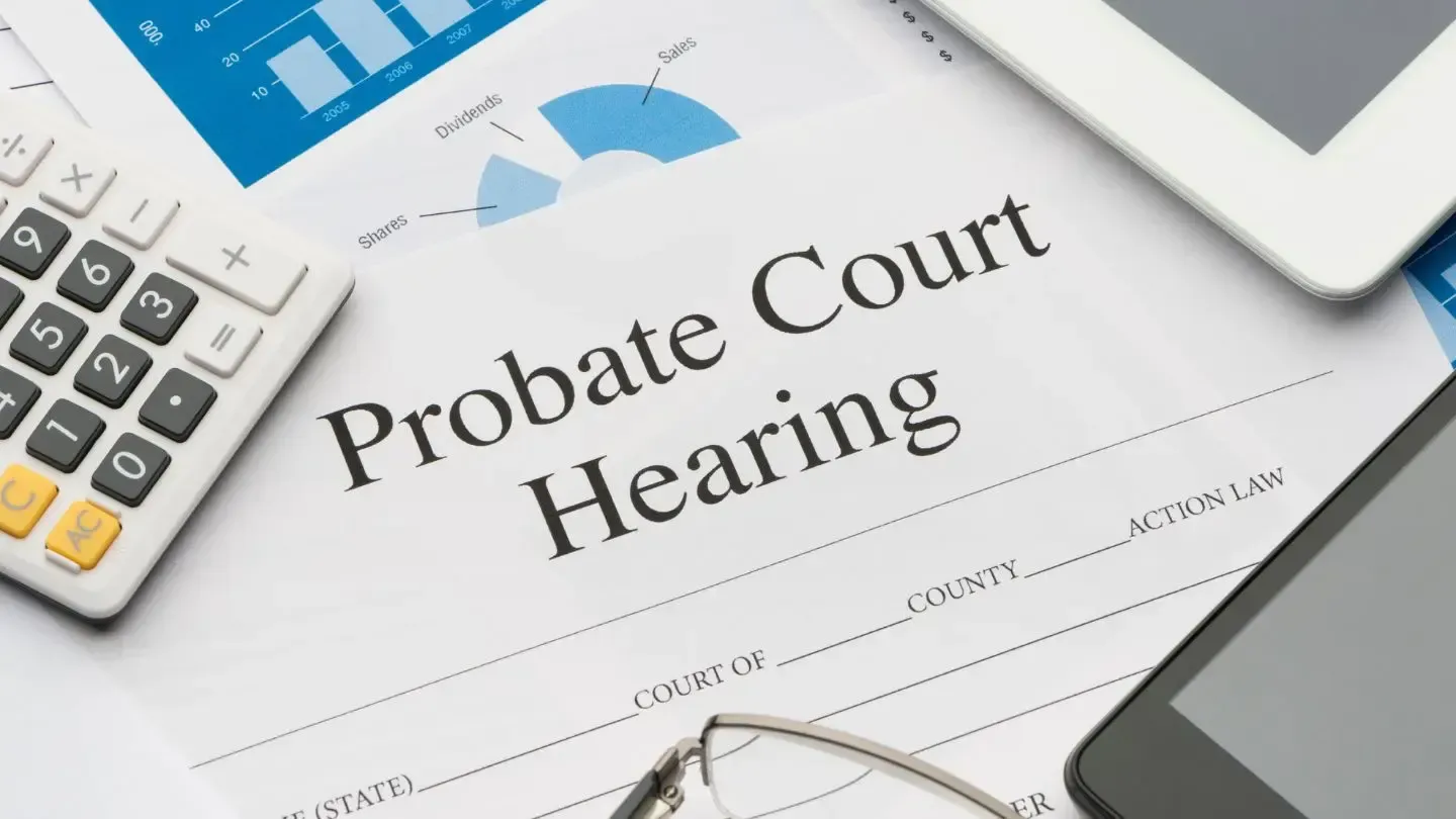 Probate Court Hearing document with a calculator, tablet, and pie chart on a desk.