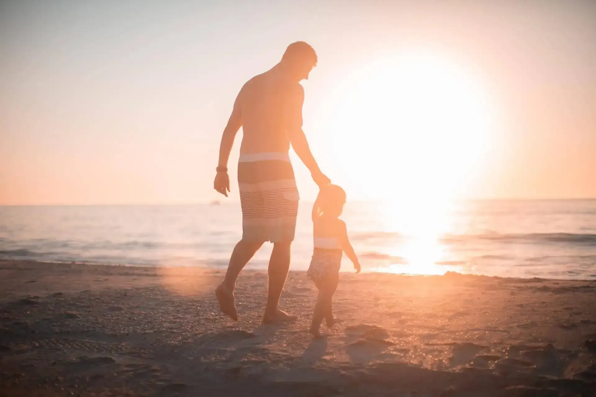 Man holding child's hand - WWL - Probate Lawyers Christchurch
