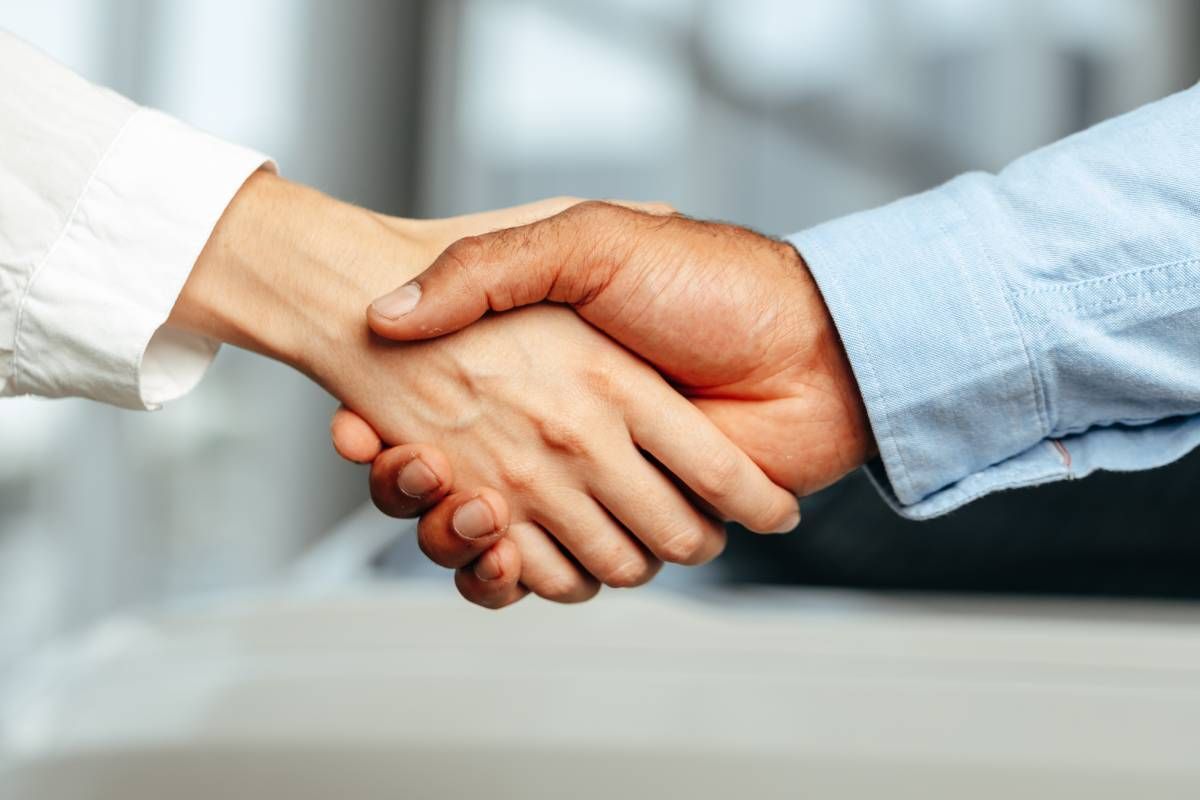 Two people shaking hands over deal near Lexington, KY