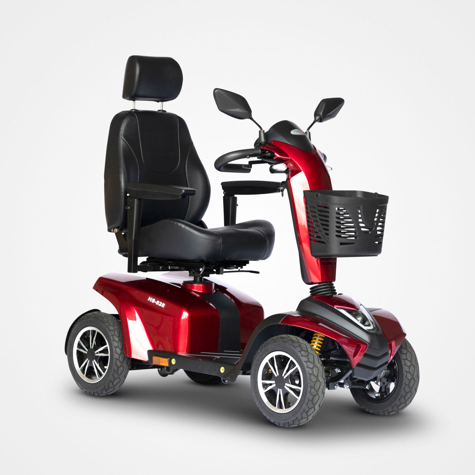 Rød mobilitetsscooter med sort sæde, kurv og bakspejle.