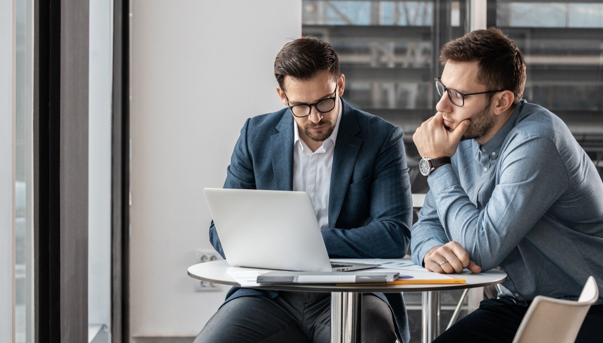 two men discussing strategic employer contributions