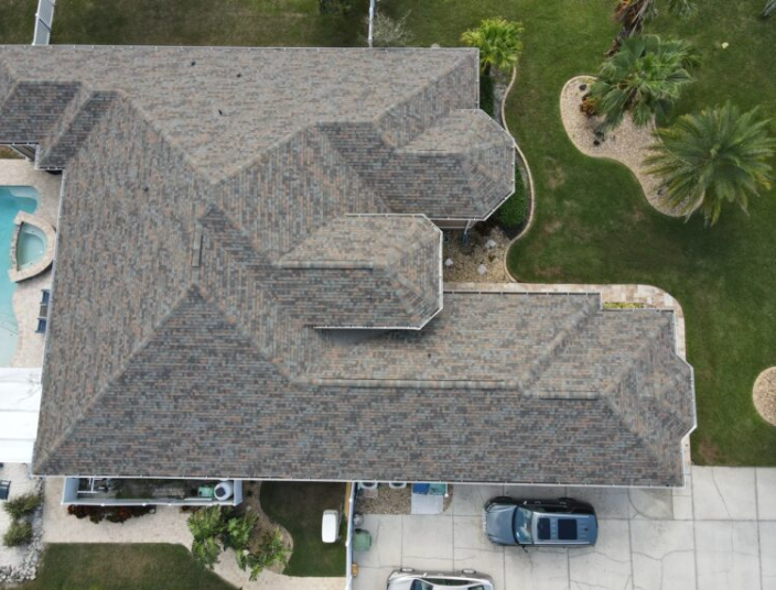 Overhead view of a completed dimensional shingle roof with multiple roof planes