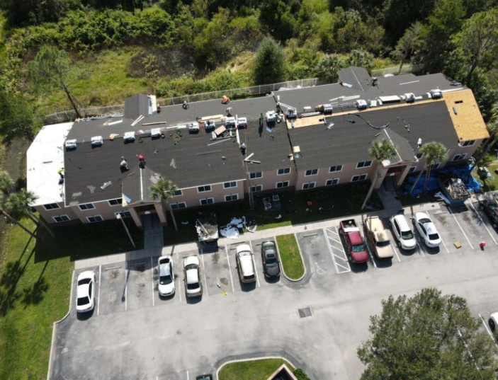 Roof replacement coordinated across occupied multi-family apartment buildings in Central Florida