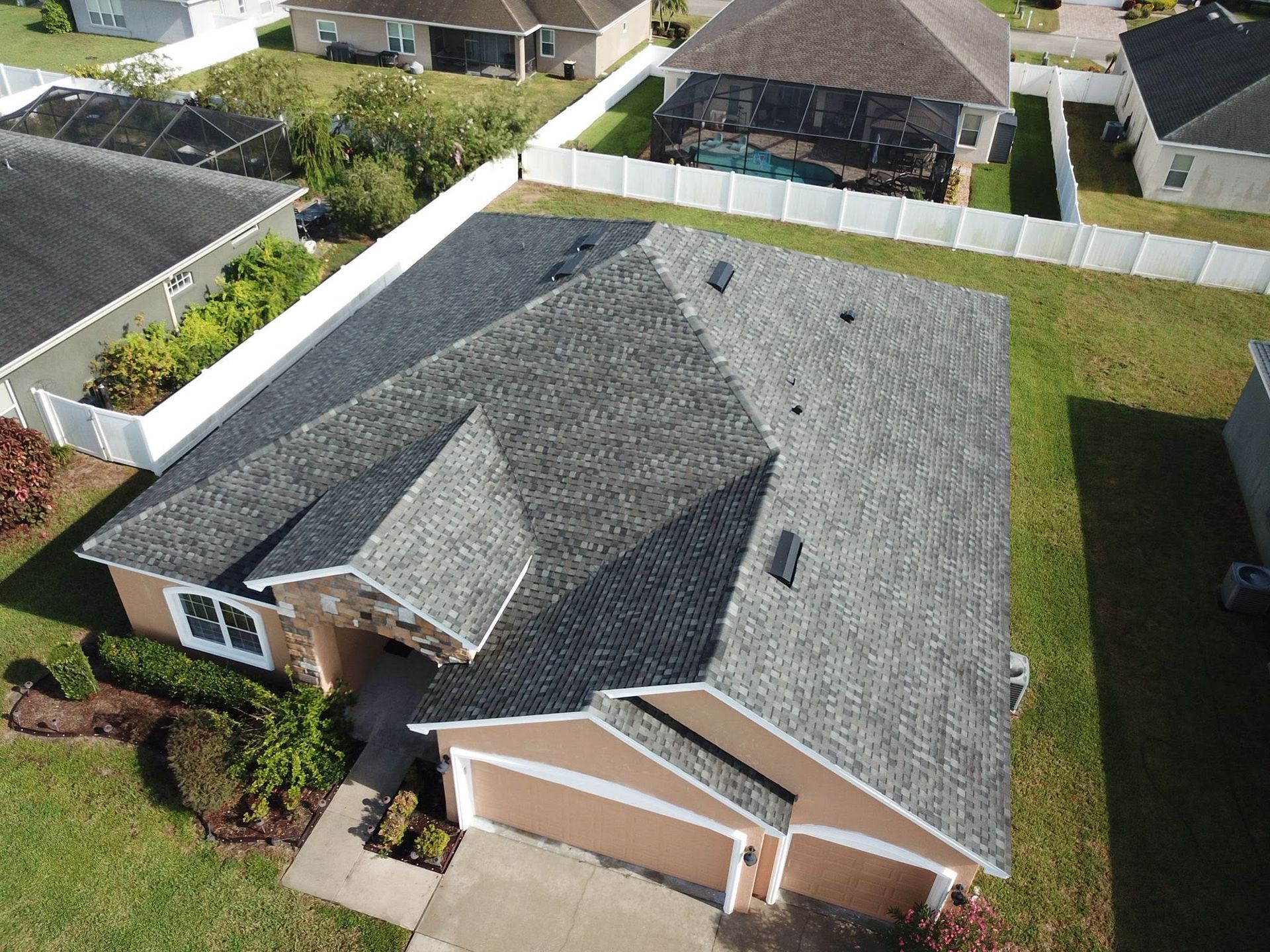 Roofing contractor inspecting a residential roof in Auburndale, Florida