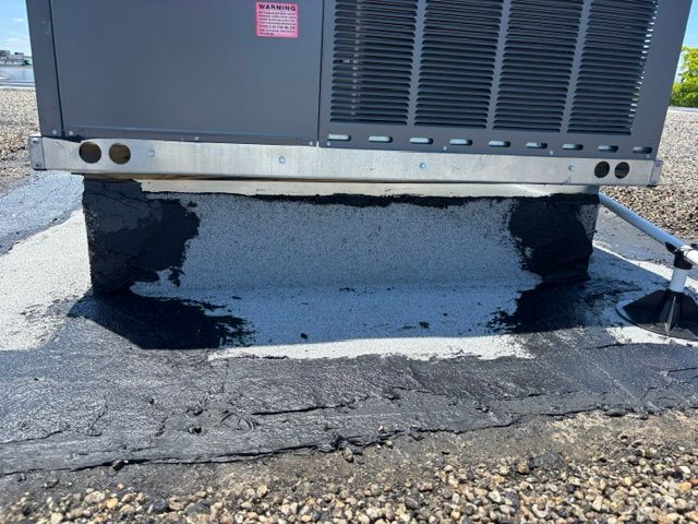 Commercial roof maintenance on a building in Auburndale, Florida