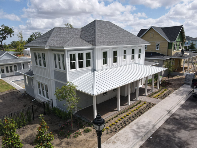 Roofing contractor evaluating an Auburndale home before roof replacement