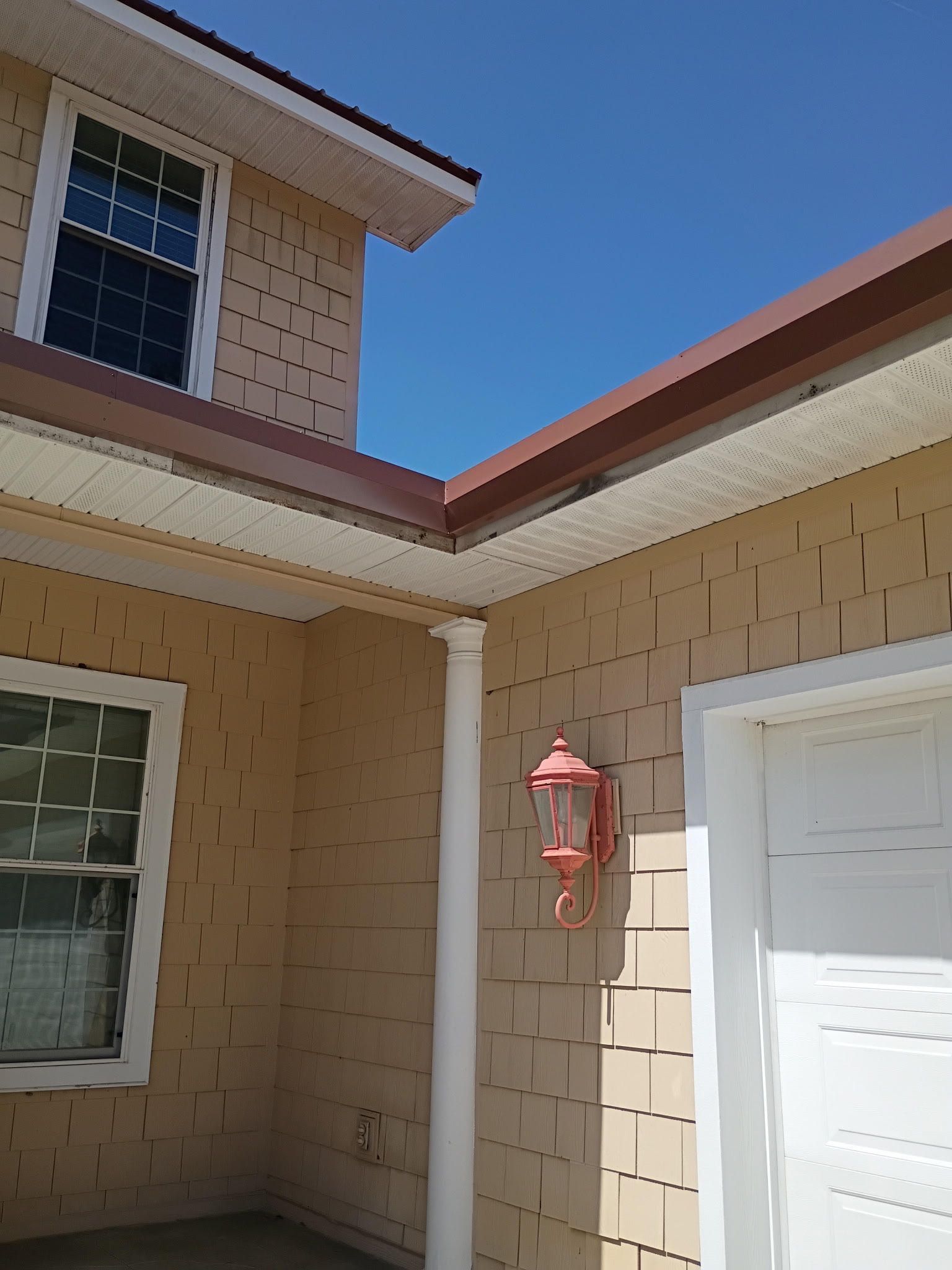 Completed seamless gutter and downspout system on an Auburndale home