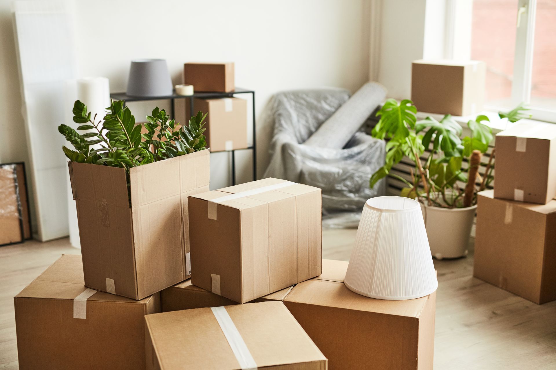 Boxes packed and wrapped ready for moving from Houston to Sugar Land, Texas