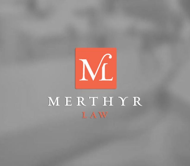 Merthyr Law logo with white “M” on orange square over gray background