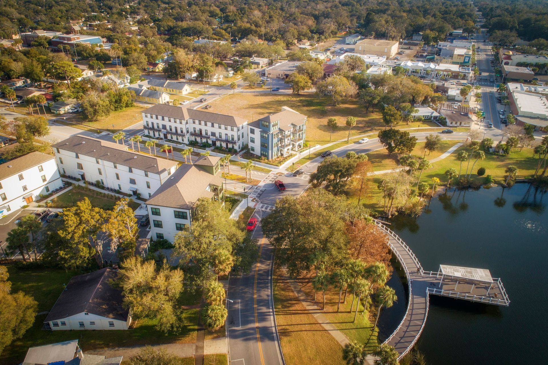 Photo showing the building, lake and surrounding area, taken from a drone