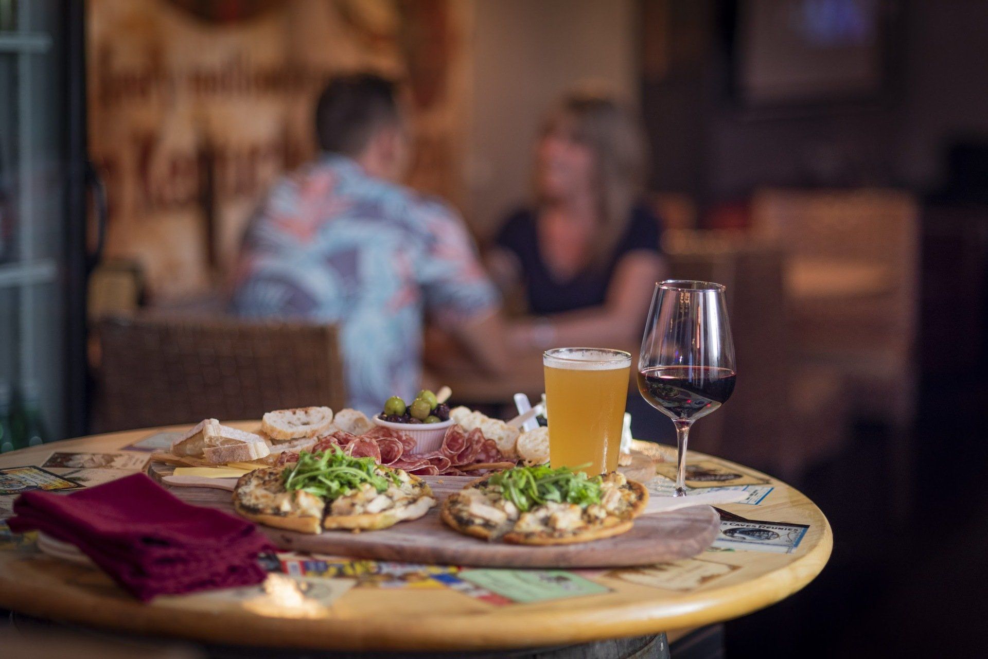 Photo showing a tray of food with people in the background
