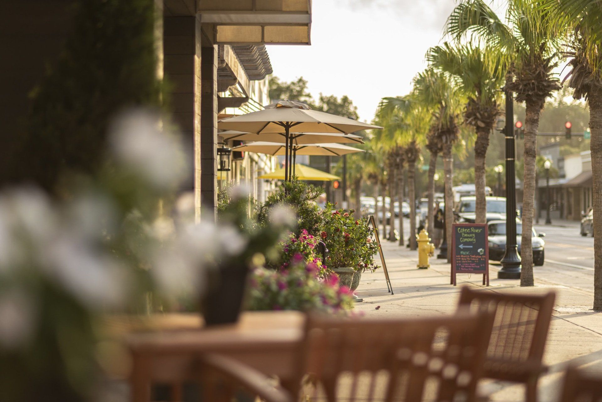 Photo showing a city street full of outdoor seating