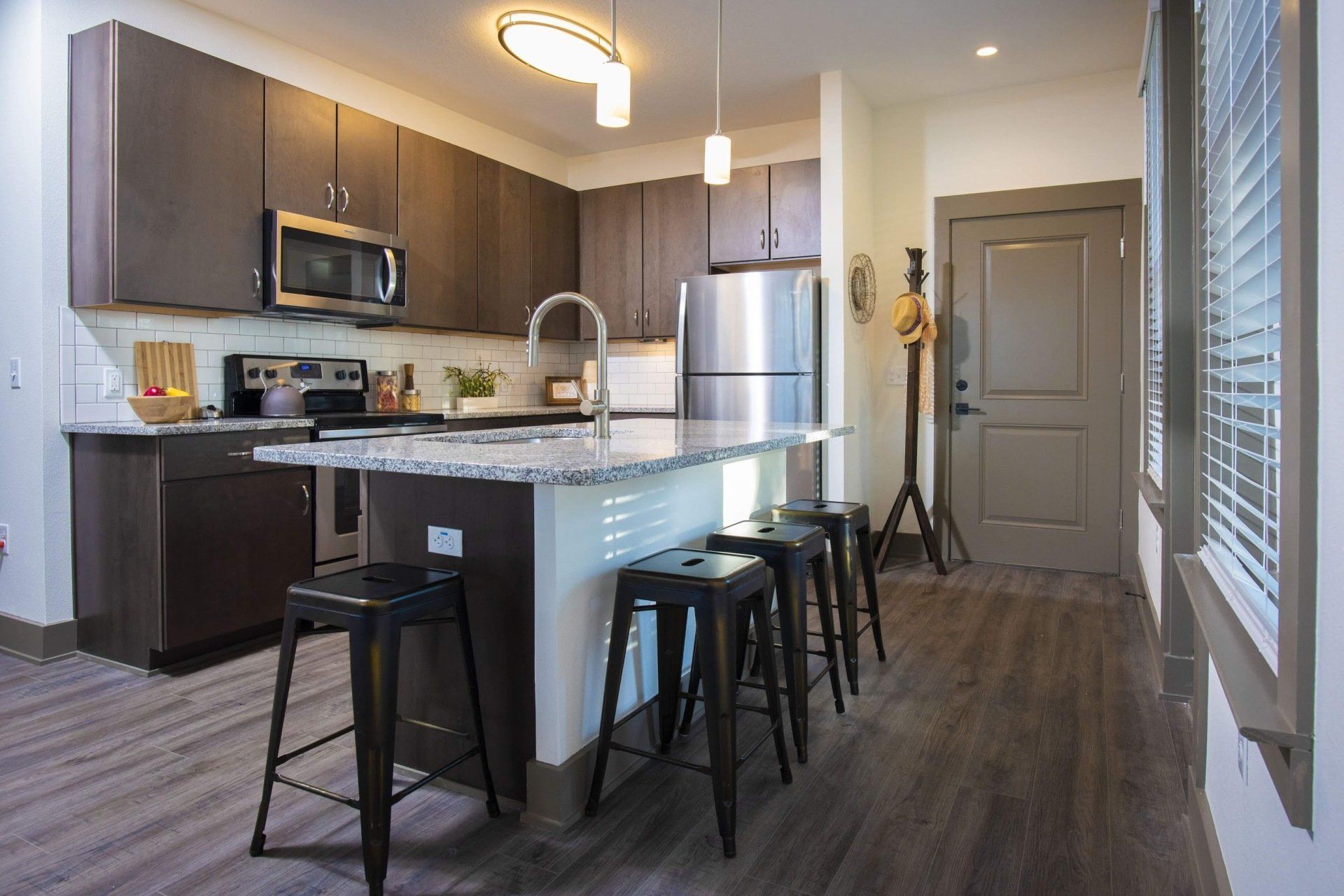 Photo showing barstool area as part of the kitchen island