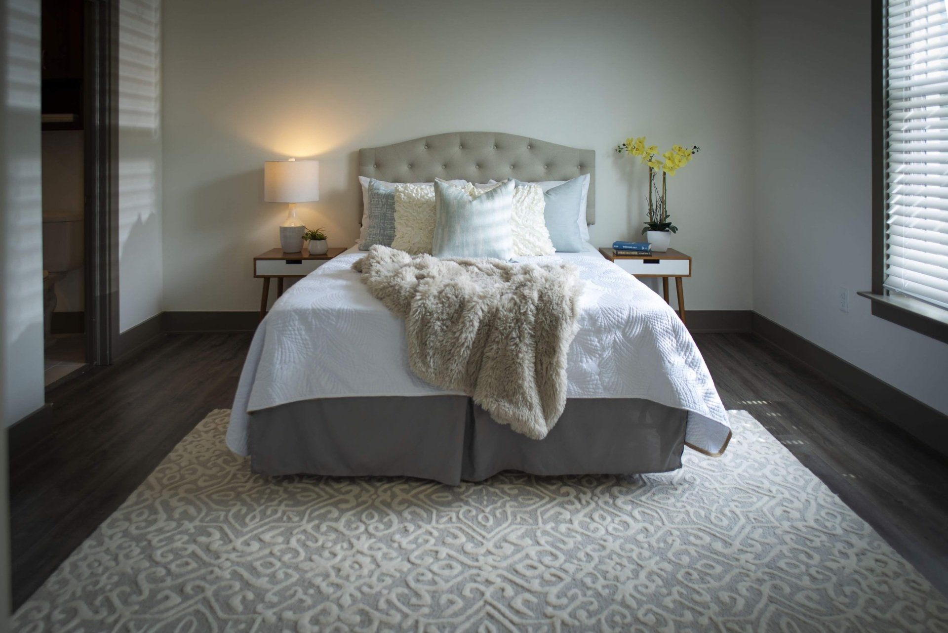 Photo showing a bedroom with plenty of natural lighting