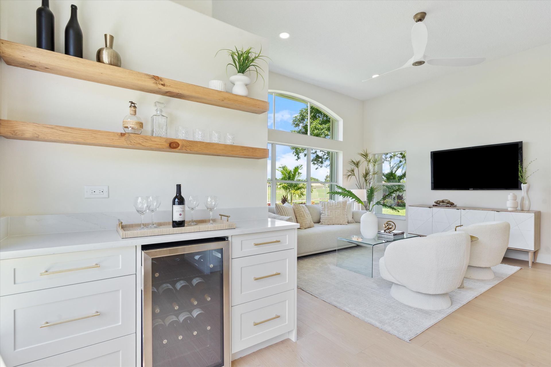 A living room with a bar and a wine cooler.