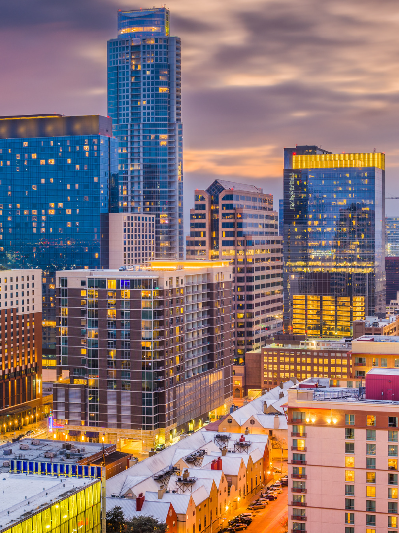 An aerial view of a city skyline at night.
