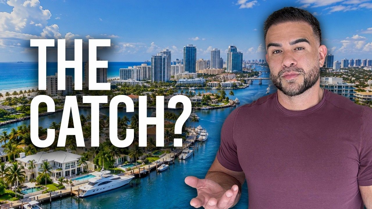 A man gestures while discussing waterfront properties and city skyline in Fort Lauderdale, Florida.