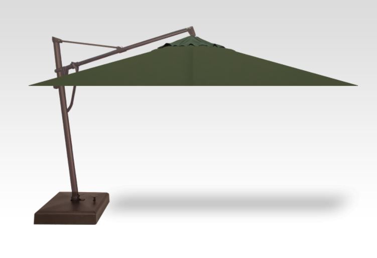 A green umbrella is sitting on a white surface
