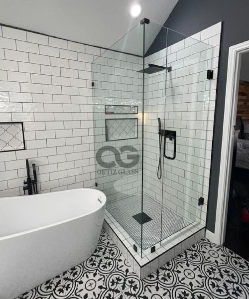 A bathroom with a bathtub and a walk in shower.