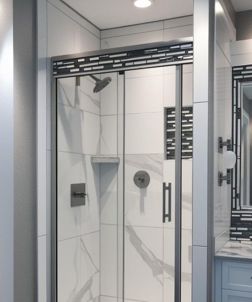 A bathroom with a sliding glass shower door