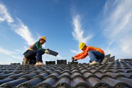 workers working on roof - hermes renovations