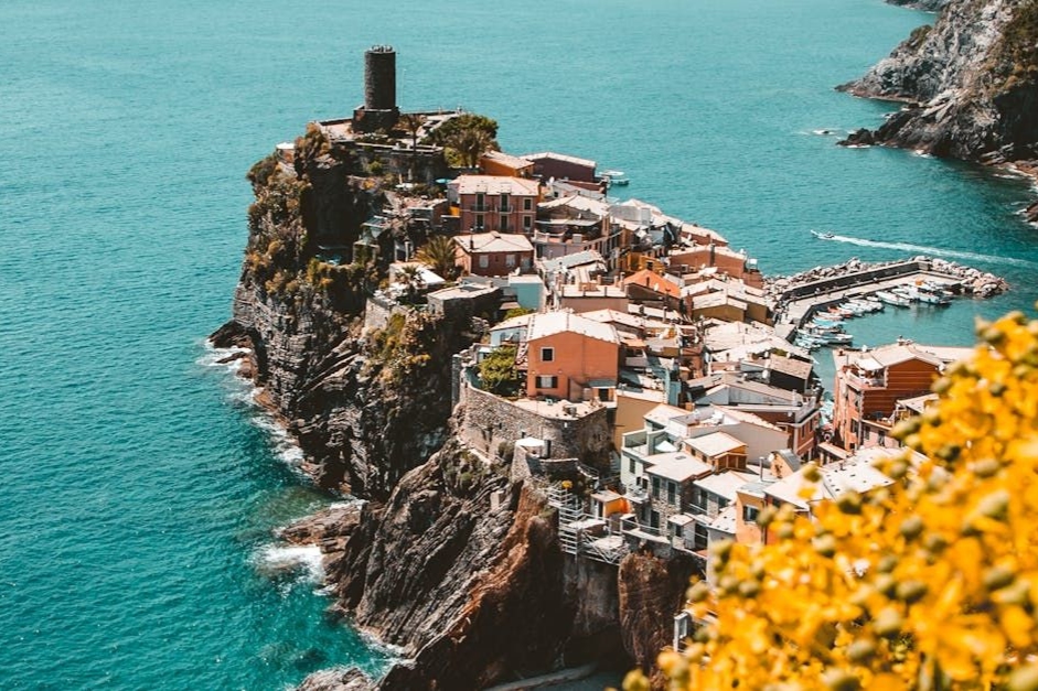 A small town on a cliff overlooking the ocean.
