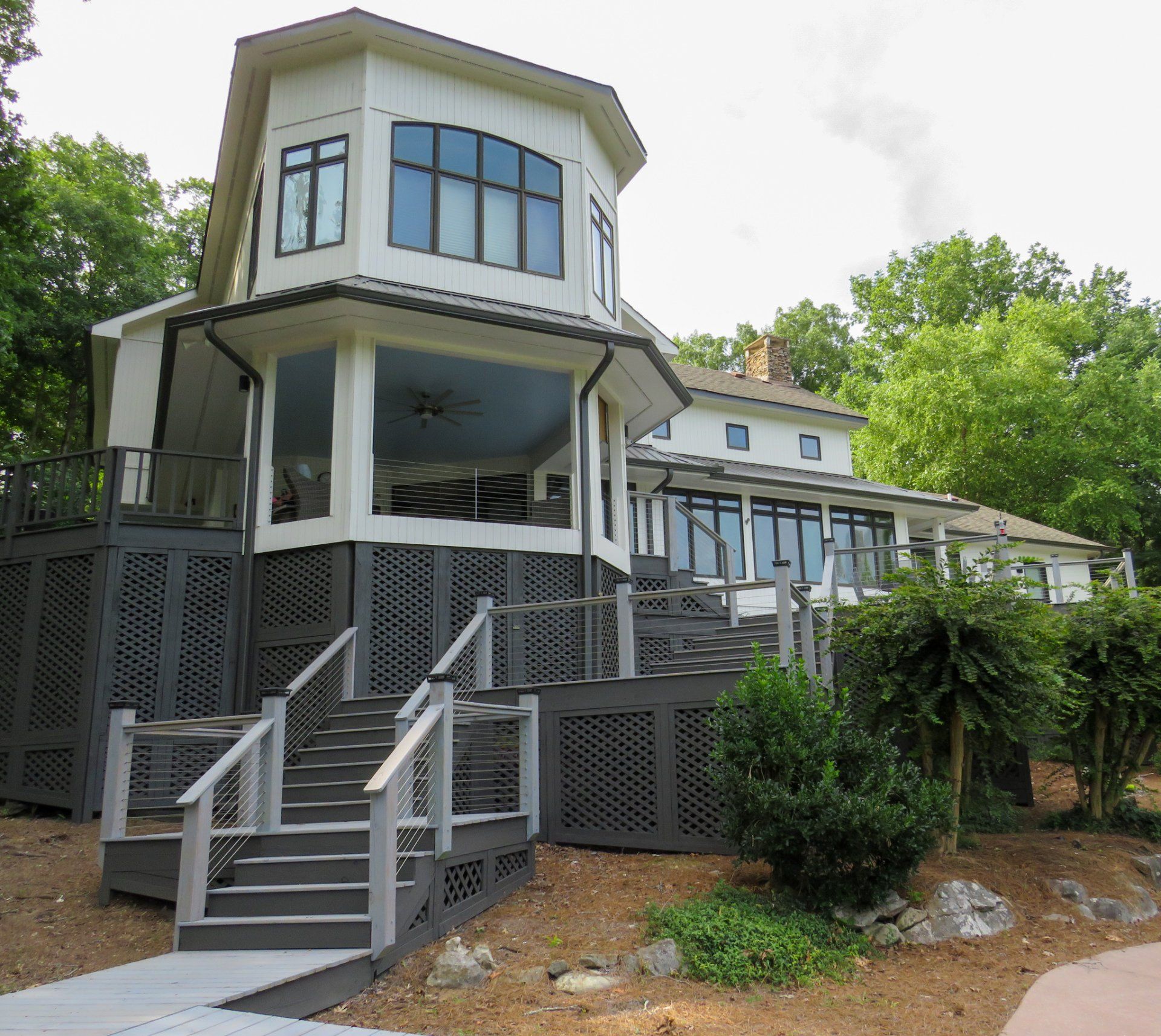 A large white house with stairs leading up to it