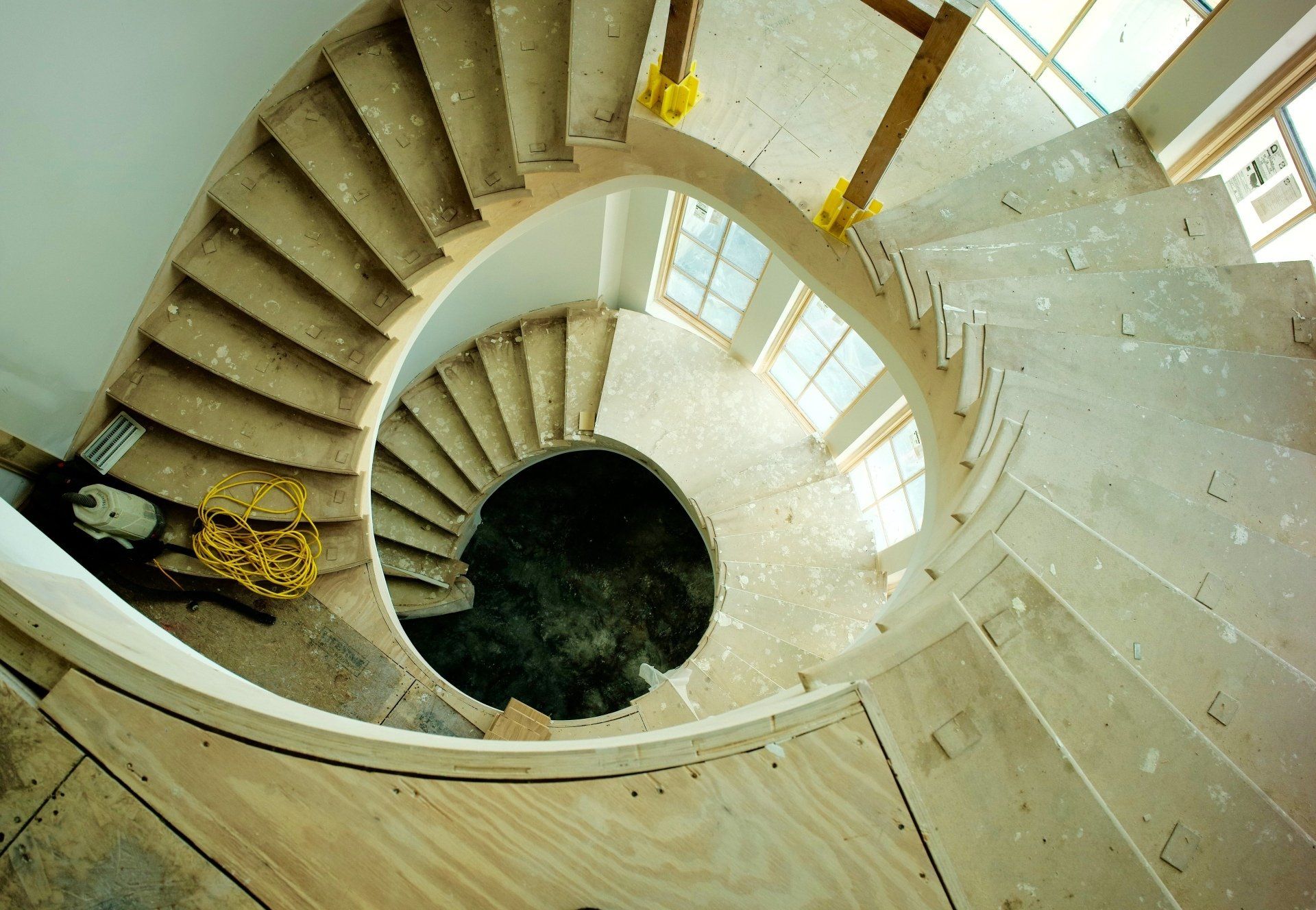 An aerial view of a spiral staircase with a hole in the middle