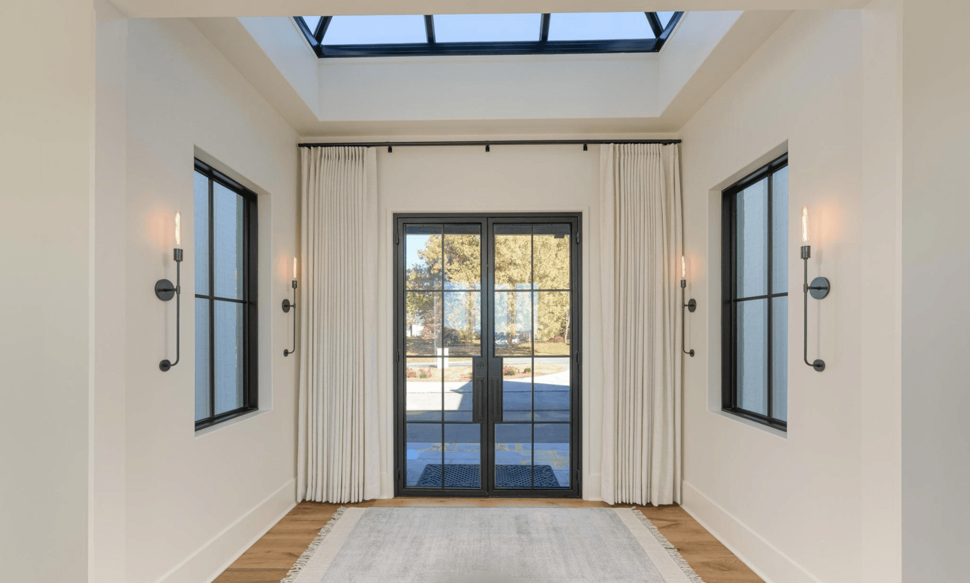 There is a skylight in the ceiling of the room.