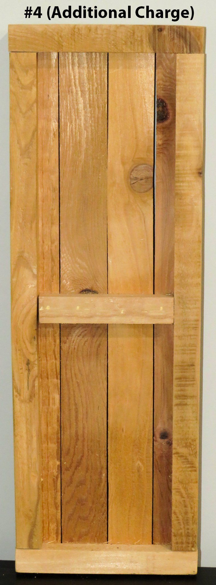 A piece of wood with the words additional charge on it