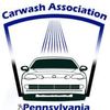 Car wash logo: Car being washed under spraying water within blue arch, with 