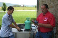 Two Workers Using Manometer — Manchester, TN — Shelton's Heating & Cooling Two Workers Using Manometer — Manchester, TN — Shelton's Heating & Cooling