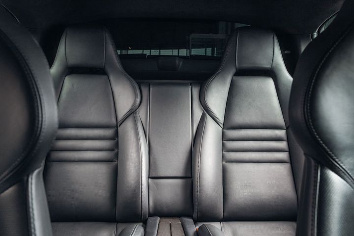 Black leather car back seats.