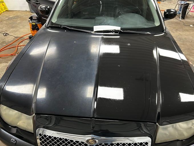 Car hood, before and after detailing, demonstrating restoration of shine.