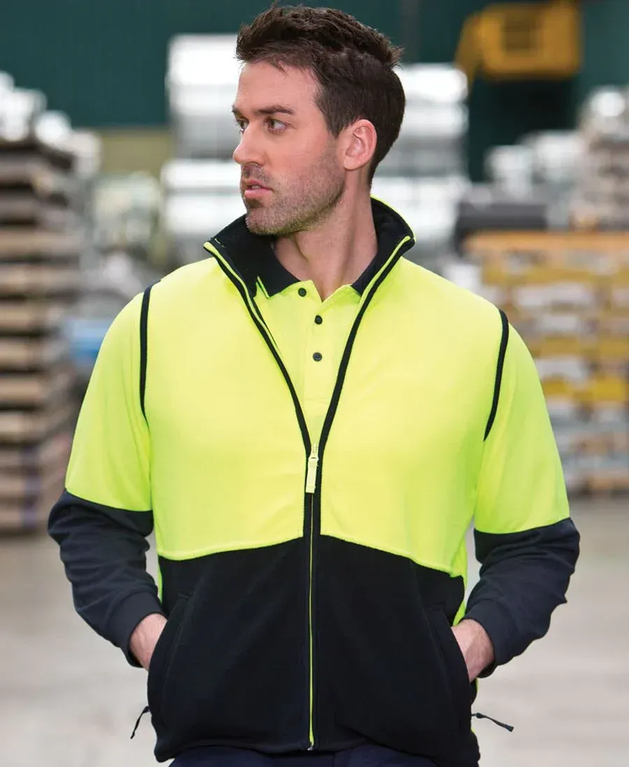 A Man Wearing a Yellow and Black Jacket With His Hands in His Pockets — Embroidery & Screen Printing in Townsville