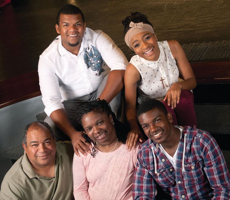 photo of the Cole family: Michael Cole, Felicia Cole, Michael Cole Jr., Avery Cole and Nadia Cole.