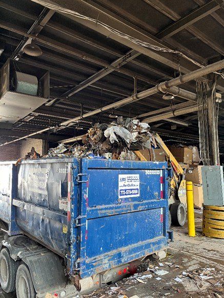 Blue Dumpster Truck — Chicago, IL — Mid America Paper Recycling Co Inc Blue Dumpster Truck — Chicago, IL — Mid America Paper Recycling Co Inc
